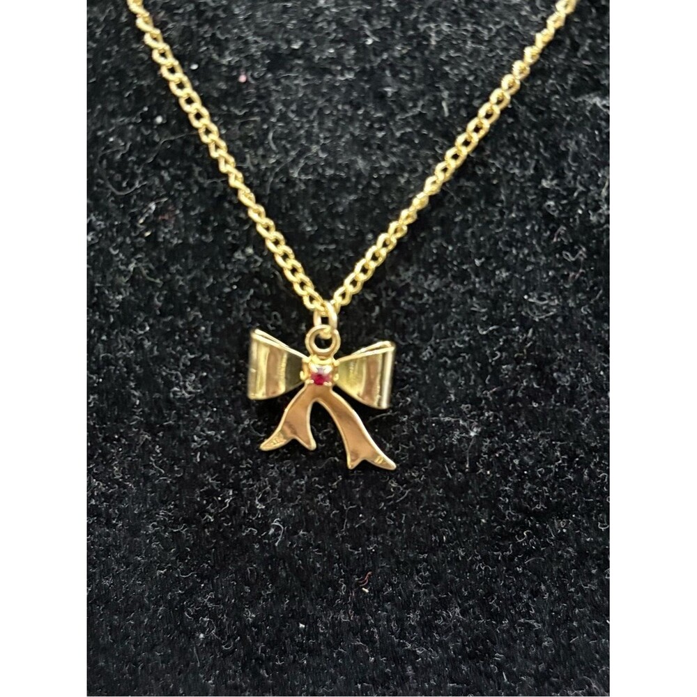 Gold Bow Pendant Necklace with Red Accent